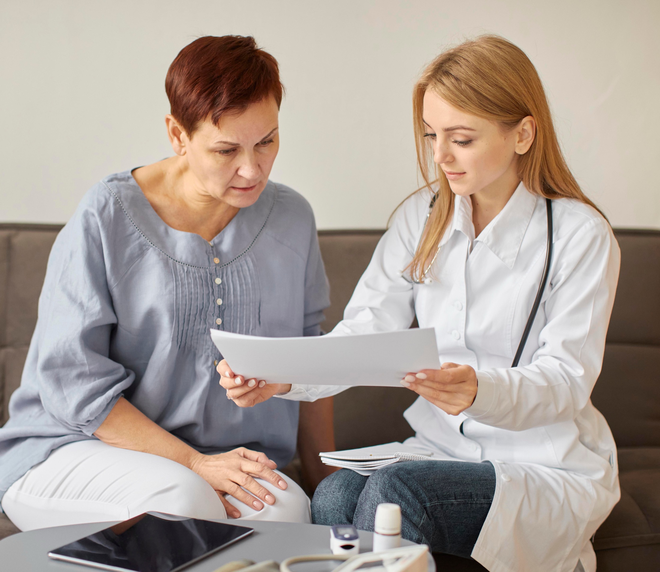 A doctor goes over test results with an older patient